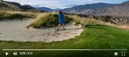 Fairway bunker shots: Man attempting to hit a 3-wood while standing in a fairway bunker.