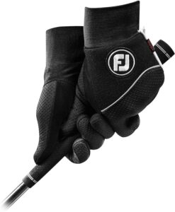 Golfer gripping a golf club with FootJoy Men's WinterSof Golf Gloves