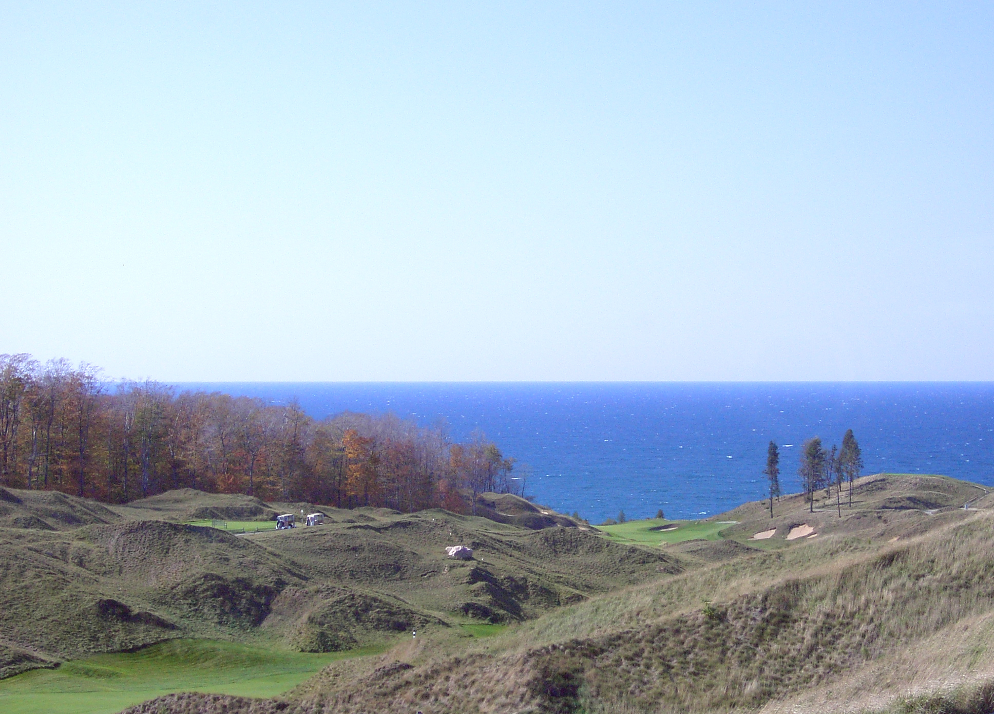 Arcadia Bluffs Golf Club on the Lake Michigan bluff in Arcadia, Michigan, looking across fairways toward the water.