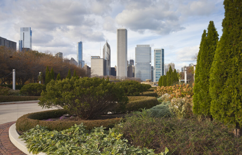 Downtown Chicago skyline viewed looking north from Grant Park, with Buckingham Fountain visible among the gardens.