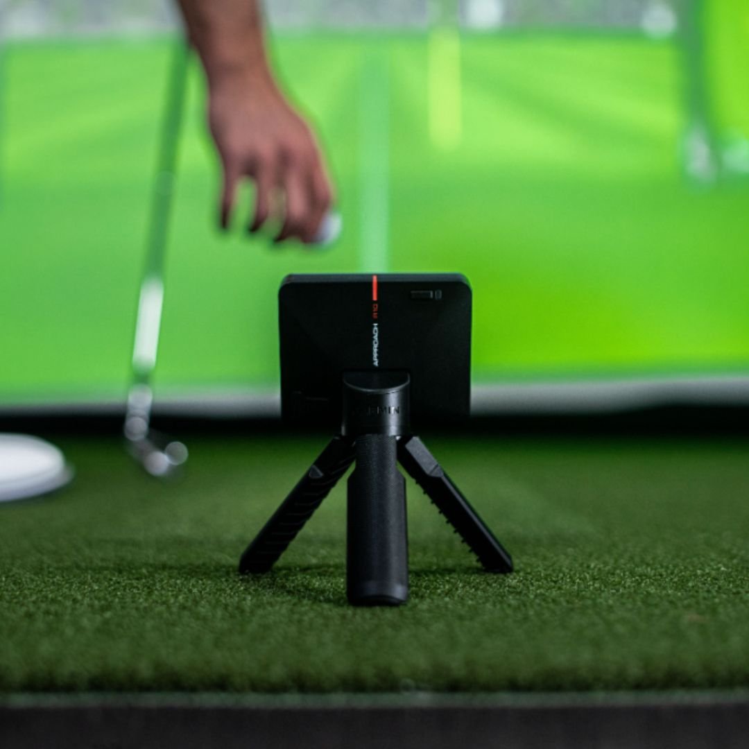 Garmin Approach R10 golf launch monitor on a tripod