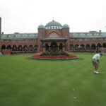 Medinah Country Club clubhouse and putting green in Medinah, Illinois, host of the 2026 Presidents Cup.