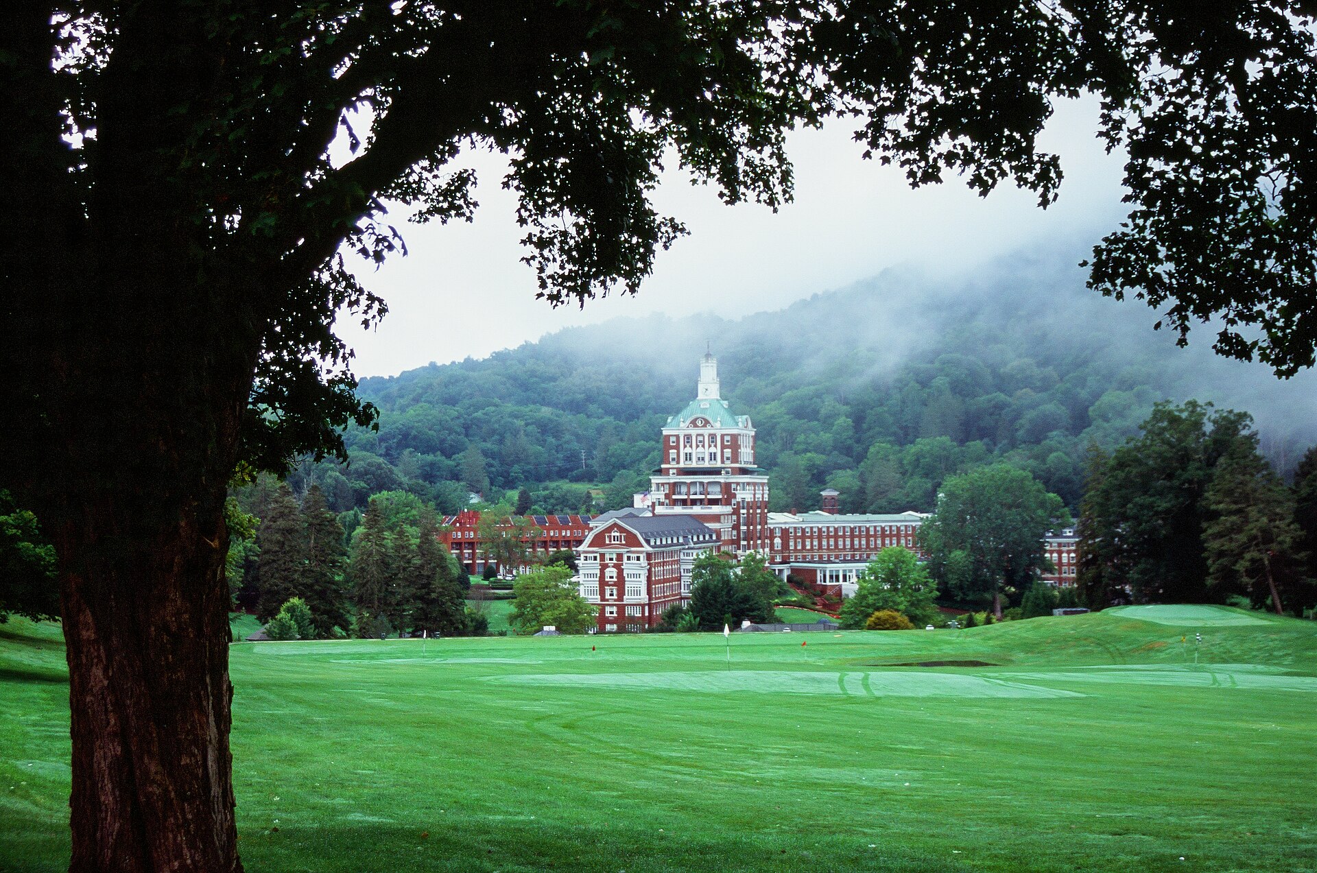 The Omni Homestead Resort in Hot Springs, Virginia, seen from the Old Course with the historic hotel rising behind the fairway.