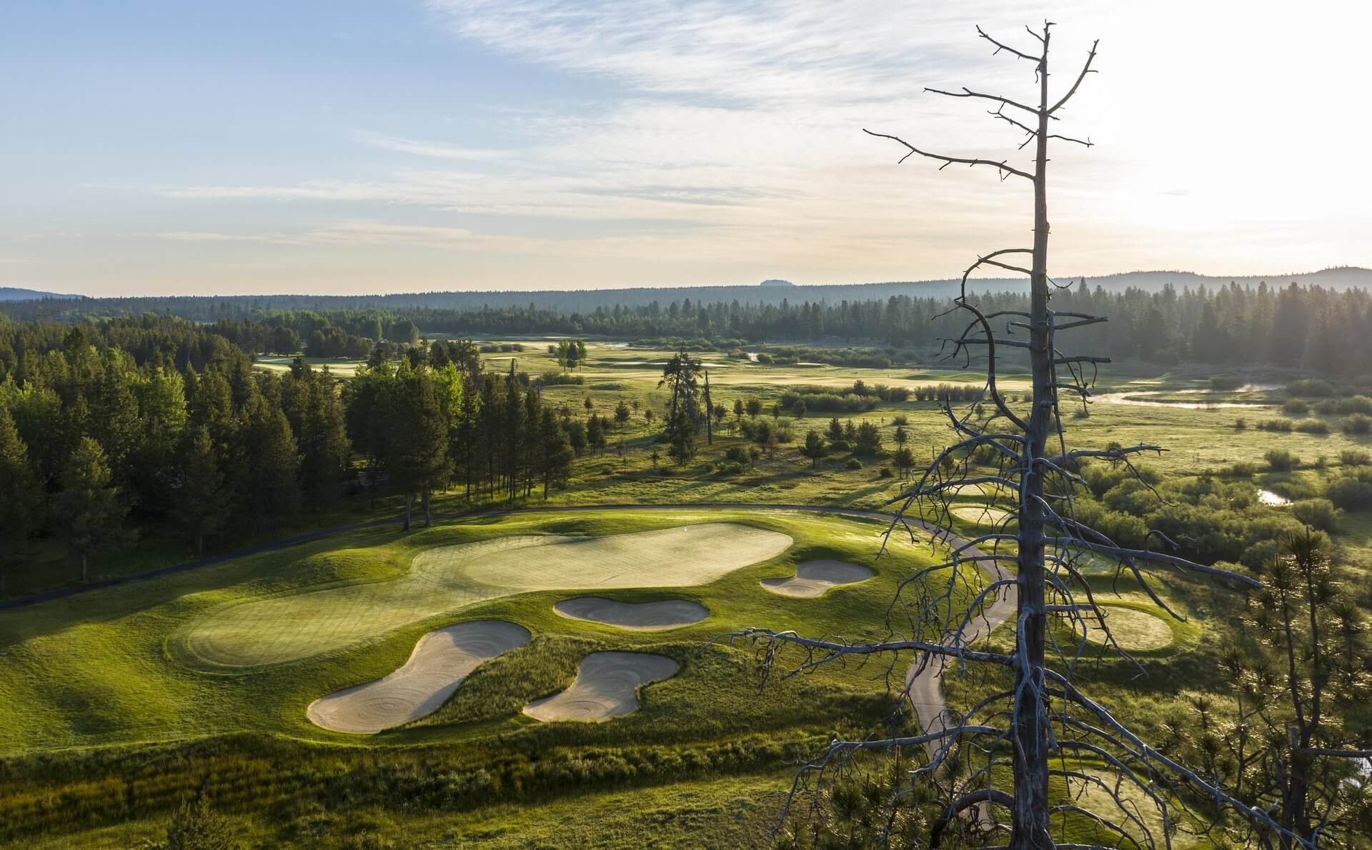 Crosswater golf course at Sunriver Resort with pines and Cascades backdrop, Central Oregon.