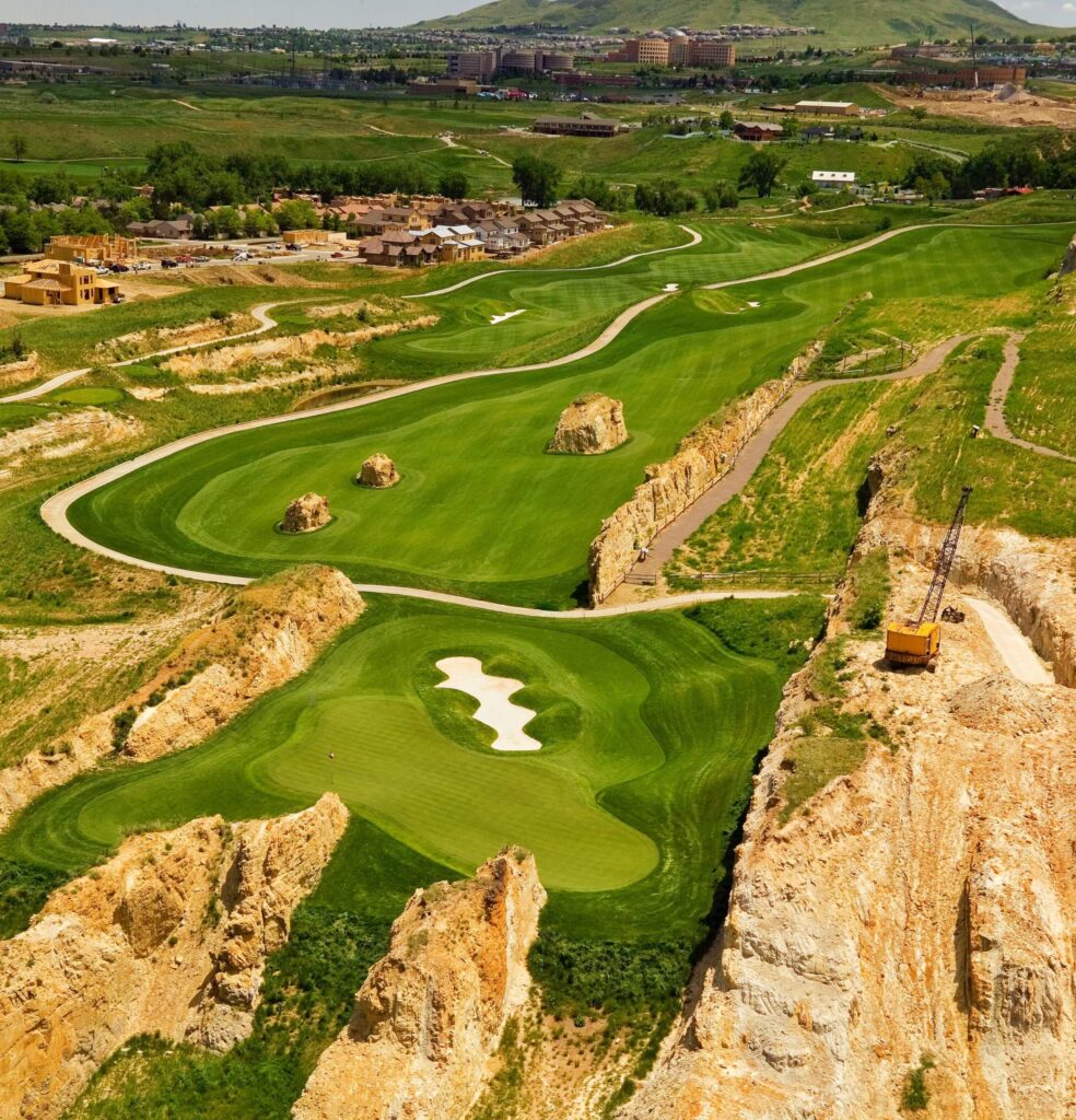Aerial view of Fossil Trace Golf Club quarry fairways and greens in Golden, Colorado.