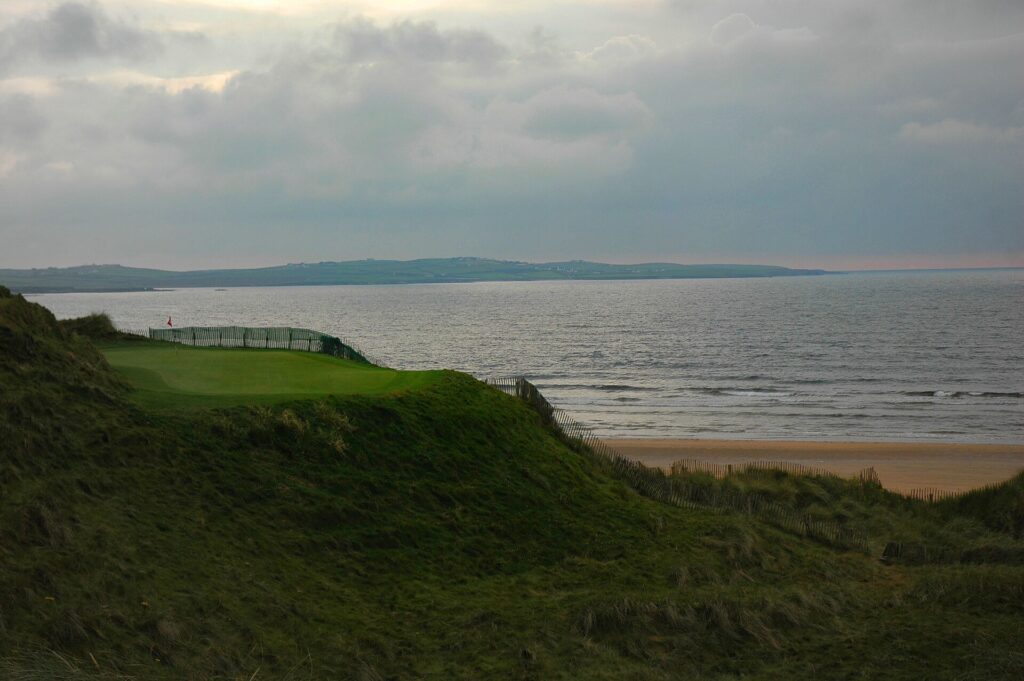 Fourteenth green at Doonbeg links overlooking Doughmore Beach on the Clare coast.