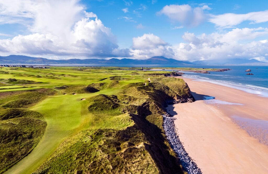 Aerial view of Tralee Golf Club links along Barrow Beach with the Dingle Peninsula beyond.