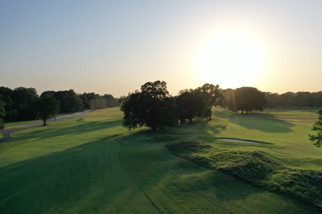 Fairway and bunker at Audubon Golf Course, Memphis Public Links, in golden light.