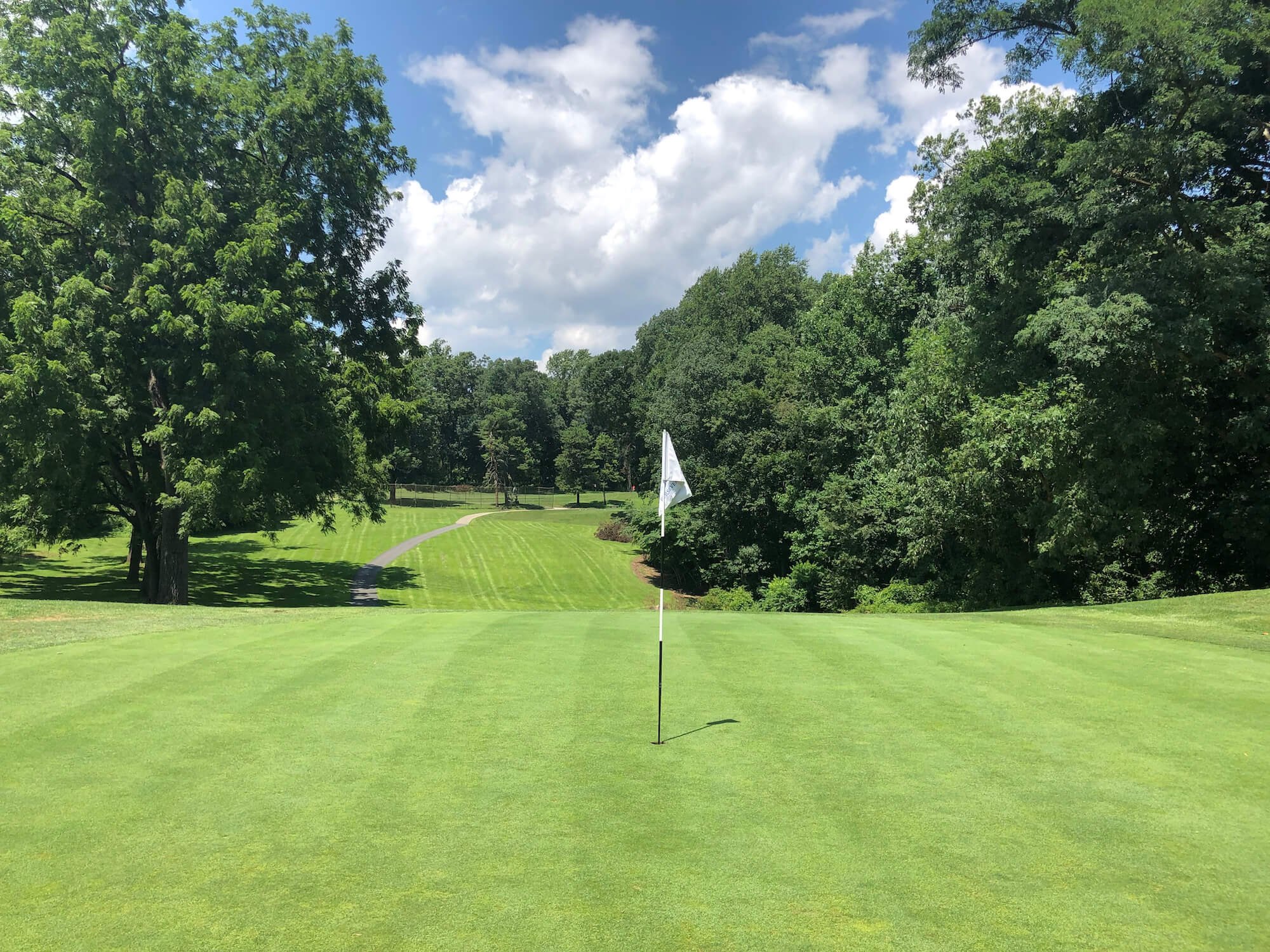 Putting green and tree-lined fairway at Walnut Lane Golf Club in Philadelphia