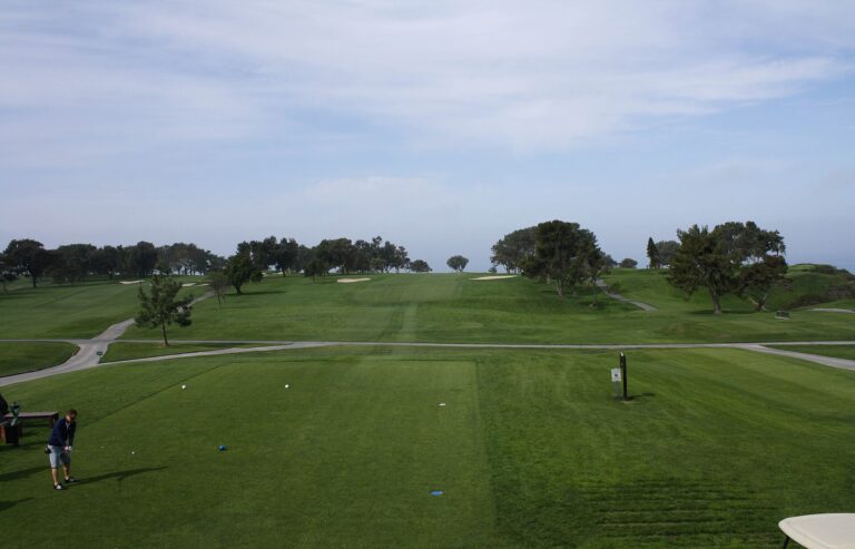 First hole fairway at Torrey Pines North Course in La Jolla, looking toward the trees and bunkers.