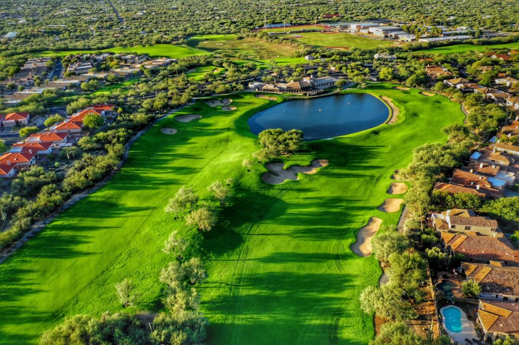 Aerial desert fairway and water hazard at Arizona National Golf Club in Tucson.
