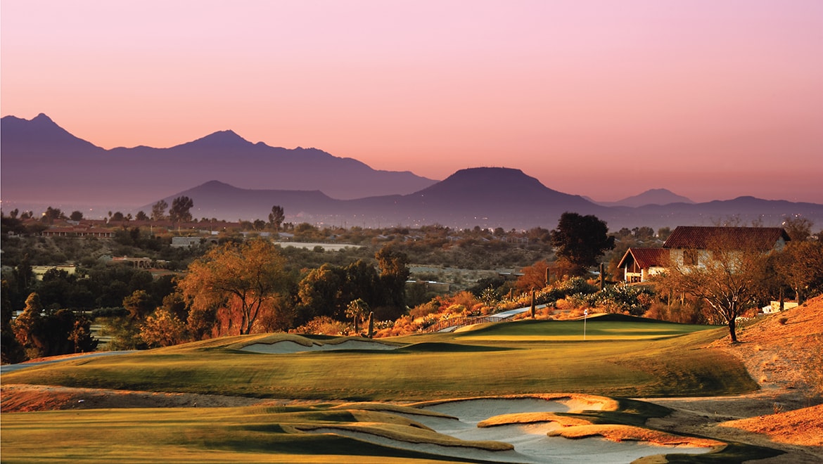 Championship golf hole at Omni Tucson National with the Santa Catalina Mountains behind the green.