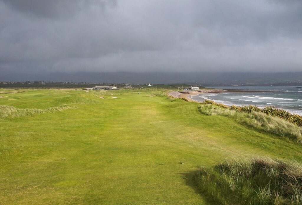 Eighteenth hole at Waterville Golf Links in County Kerry, fairway running beside the Atlantic.
