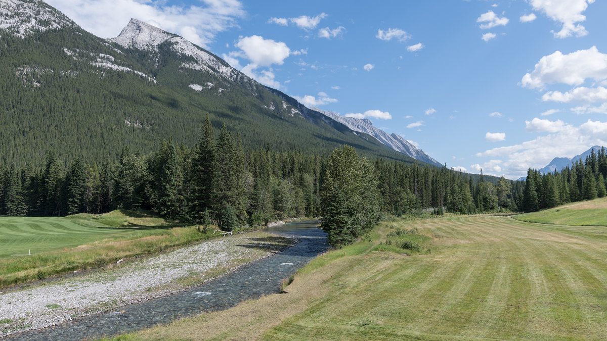 Banff Springs golf course beside the Spray River below the Rocky Mountains