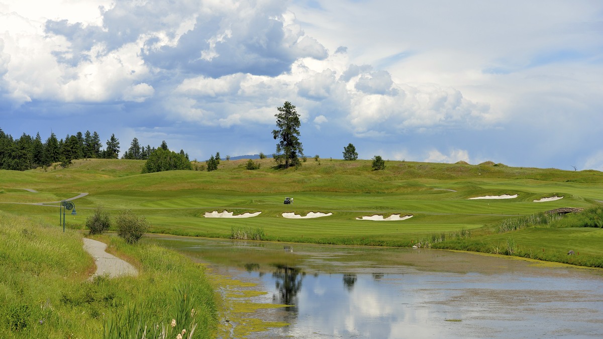 Pond, bunkers and fairway at Predator Ridge Golf Resort near Vernon, British Columbia