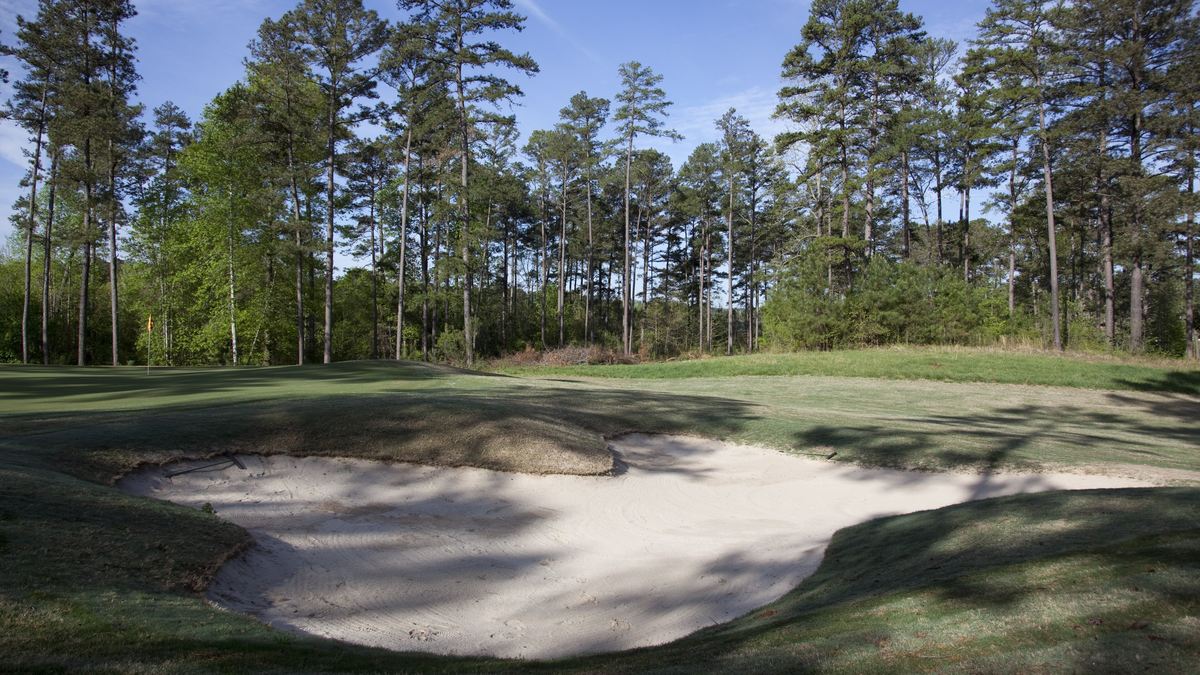 Greenside bunker and pines at Grand National on the Robert Trent Jones Golf Trail in Opelika, Alabama