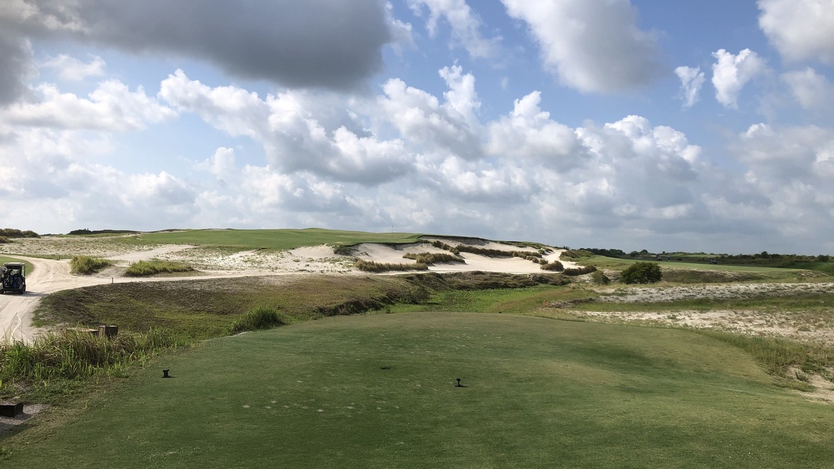 Par-3 fifth hole on the Black course at Streamsong surrounded by sand